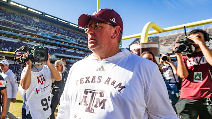 Nov 22, 2025; College Station, Texas, USA; Texas A&M Aggies head coach Mike Elko walks off the field after defeating the Samford Bulldogs 48-0 in a game at Kyle Field. Mandatory Credit: Joseph Buvid-Imagn Images