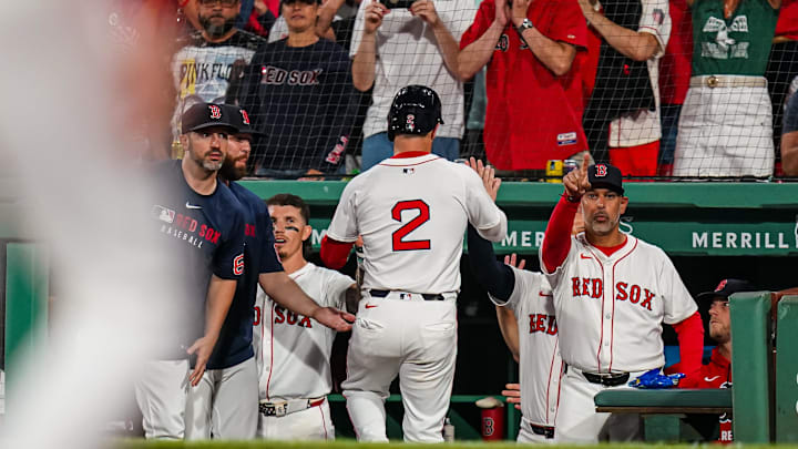 Aug 5, 2025; Boston, Massachusetts, USA; Boston Red Sox third base Alex Bregman (2) is congratulated after scoring against the Kansas City Royals in the seventh inning at Fenway Park. Mandatory Credit: David Butler II-Imagn Images