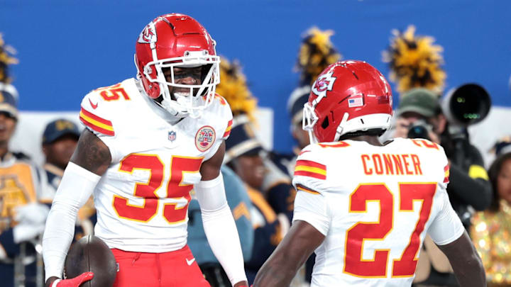 Sep 21, 2025; East Rutherford, New Jersey, USA; Kansas City Chiefs cornerback Jaylen Watson (35) celebrates with defensive back Chamarri Conner (27) after an interception in the second quarter at MetLife Stadium. Mandatory Credit: Vincent Carchietta-Imagn Images