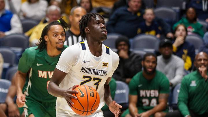 Dec 22, 2025; Morgantown, West Virginia, USA; West Virginia Mountaineers guard Morris Ugusuk (23) dribbles the ball during the first half against the Mississippi Valley State Delta Devils at Hope Coliseum. Mandatory Credit: Ben Queen-Imagn Images