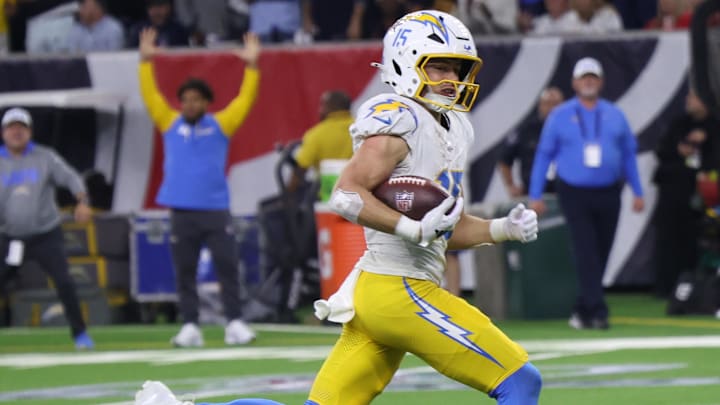 Jan 11, 2025; Houston, Texas, USA;  Los Angeles Chargers wide receiver Ladd McConkey (15) scores on a pass in the fourth quarter against the Houston Texans in an AFC wild card game at NRG Stadium. Mandatory Credit: Thomas Shea-Imagn Images