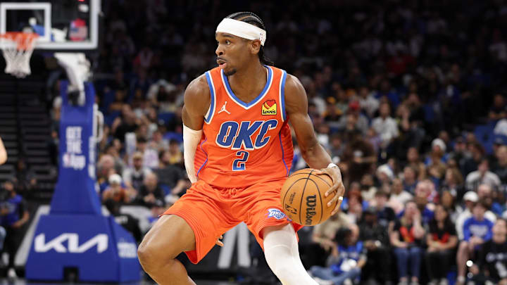 Dec 19, 2024; Orlando, Florida, USA; Oklahoma City Thunder guard Shai Gilgeous-Alexander (2) controls the ball against the Orlando Magic in the fourth quarter at Kia Center. Mandatory Credit: Nathan Ray Seebeck-Imagn Images