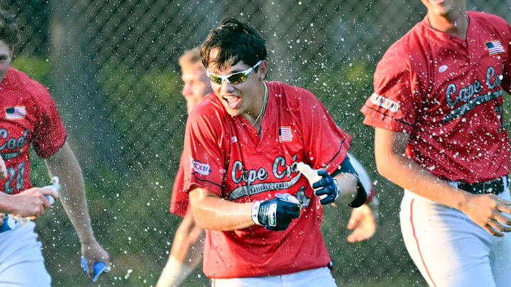 SOUTH YARMOUTH 07/06/23 The Y-D team celebrates with Dub Gleed (center) after his hit that scored the walk off run in the 10th inning for a 4-3 victory over Bourne. Cape League baseball SOUTH YARMOUTH 07/06/23 The Y-D team celebrates with Dub Gleed (center) after his hit that scored the walk off run in the 10th inning for a 4-3 victory over Bourne. Cape League baseball