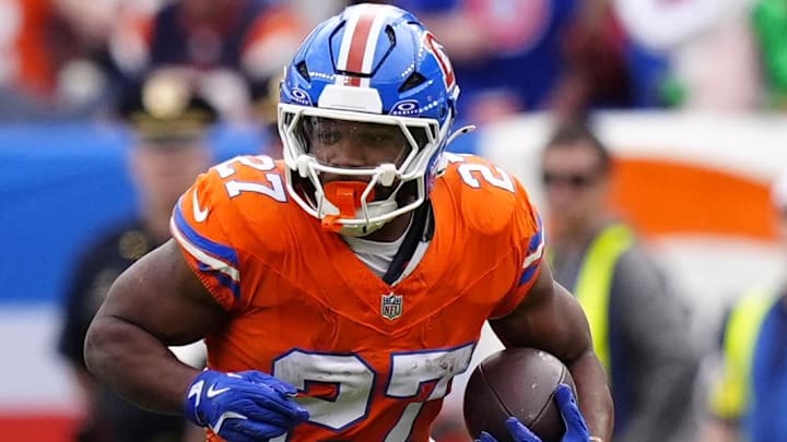 Oct 26, 2025; Denver, Colorado, USA; Denver Broncos running back J.K. Dobbins (27) runs against the Dallas Cowboys in the first half at Empower Field at Mile High. Mandatory Credit: Ron Chenoy-Imagn Images
