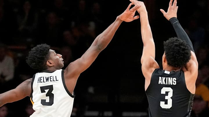Iowa guard Drew Thelwell (3) defends a shot attempted by Michigan State guard Jaden Akins (3) during a Big Ten Conference game Thursday, March 6, 2025 at Carver-Hawkeye Arena in Iowa City.