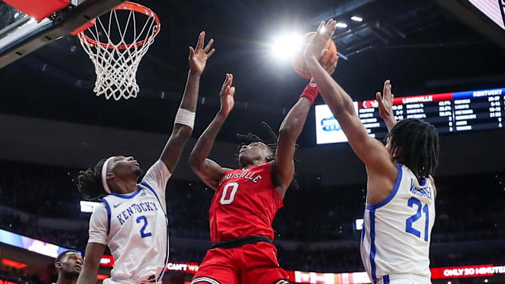 Louisville   s Mike James goes in for a shot in the second half against Kentucky. The Wildcats won 95-76 at the KFC Yum! Center on Thursday, December 21, 2023