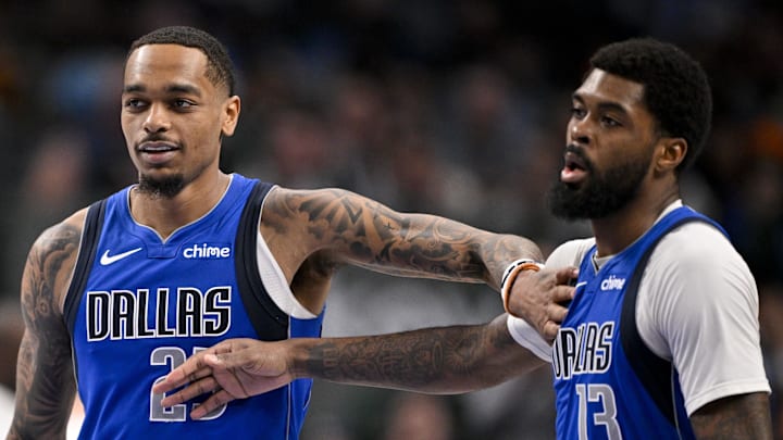Jan 17, 2025; Dallas, Texas, USA; Dallas Mavericks forward P.J. Washington (25) and forward Naji Marshall (13) celebrate during the second quarter against the Oklahoma City Thunder at the American Airlines Center. Mandatory Credit: Jerome Miron-Imagn Images
