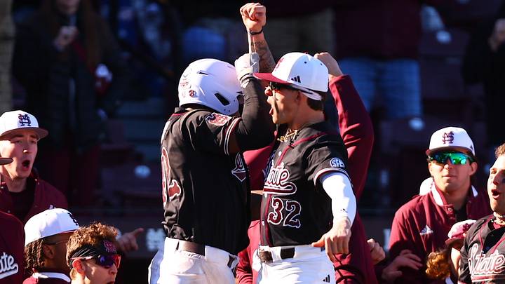 Mississippi State Baseball team celebrates following a home run by Dakota Jordan.