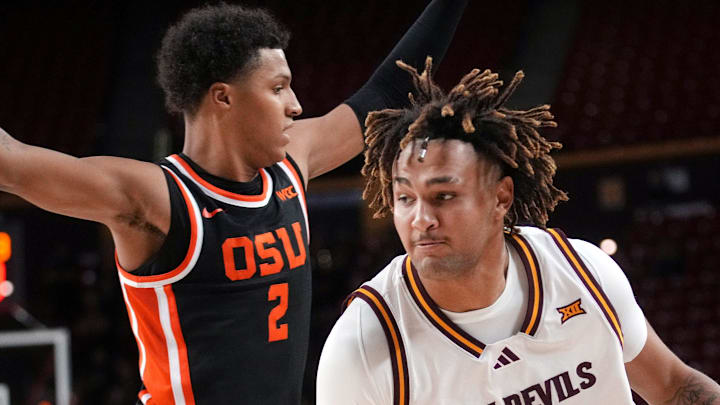 ASU Sun Devils forward Marcus Adams Jr. (8) drives past Oregon State Beavers guard Josiah Lake II (2) at Desert Financial Arena in Tempe on Dec. 21, 2025.