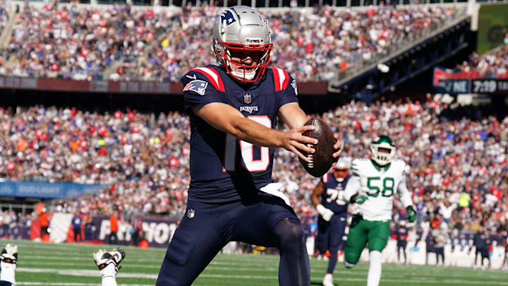 Oct 27, 2024; Foxborough, Massachusetts, USA; New England Patriots quarterback Drake Maye (10) runs the ball for a touchdown against the New York Jets in the first quarter at Gillette Stadium. Mandatory Credit: David Butler II-Imagn Images
