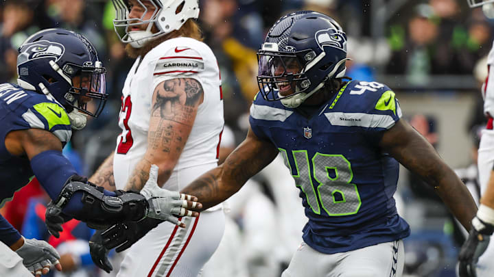 Nov 24, 2024; Seattle, Washington, USA; Seattle Seahawks linebacker Tyrice Knight (48) celebrates with linebacker Ernest Jones IV (13) following a sack against the Arizona Cardinals during the first quarter at Lumen Field. Nov 24, 2024; Seattle, Washington, USA; Seattle Seahawks linebacker Tyrice Knight (48) celebrates with linebacker Ernest Jones IV (13) following a sack against the Arizona Cardinals during the first quarter at Lumen Field.