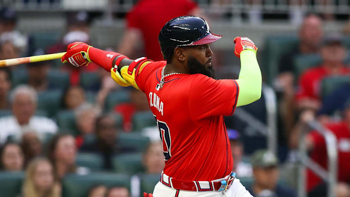 Apr 19, 2024; Atlanta, Georgia, USA; Atlanta Braves designated hitter Marcell Ozuna (20) hits a RBI single against the Texas Rangers in the first inning at Truist Park.