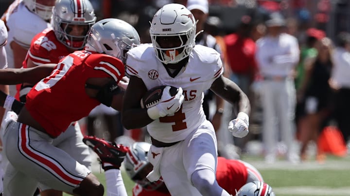 Texas Longhorns running back CJ Baxter (4) rushes the ball against the Ohio State Buckeyes in the first half at Ohio Stadium. 