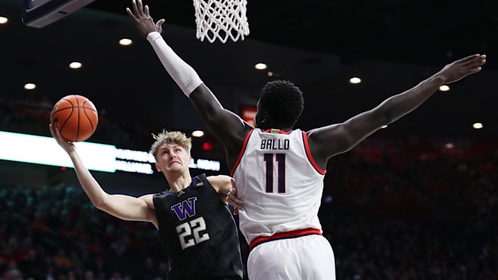 Washington guard Cole Bajema (22) drives to the basket against Arizona center Oumar Ballo (11) at the McKale Center. 