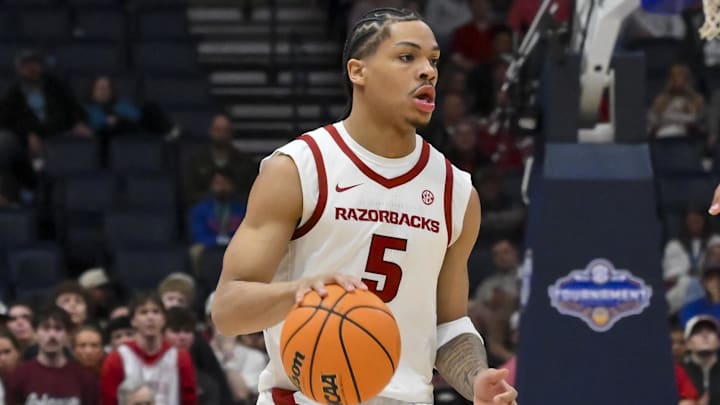 Arkansas Razorbacks guard Darius Acuff Jr. (5) brings the ball up court against the Oklahoma Sooners during the first half at Bridgestone Arena. 