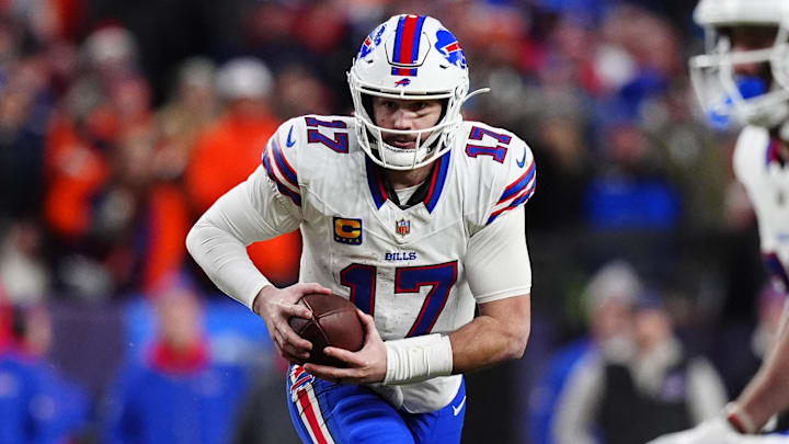 Buffalo Bills quarterback Josh Allen (17) runs during the fourth quarter of an AFC Divisional Round playoff game against the Denver Broncos at Empower Field at Mile High.