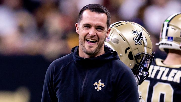 New Orleans Saints quarterback Derek Carr reacts to a play while on the sidelines.
