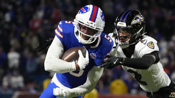 Sep 7, 2025; Orchard Park, New York, USA;  Buffalo Bills wide receiver Joshua Palmer (5) runs the ball against Baltimore Ravens cornerback Nate Wiggins (2) during the fourth quarter at Highmark Stadium. Mandatory Credit: Gregory Fisher-Imagn Images