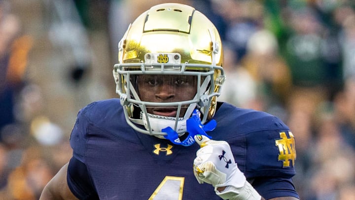 Nov 22, 2025; South Bend, Indiana, USA; Notre Dame Fighting Irish running back Jeremiyah Love (4) runs the ball against the Syracuse Orange during the first half at Notre Dame Stadium. Mandatory Credit: Michael Caterina-Imagn Images