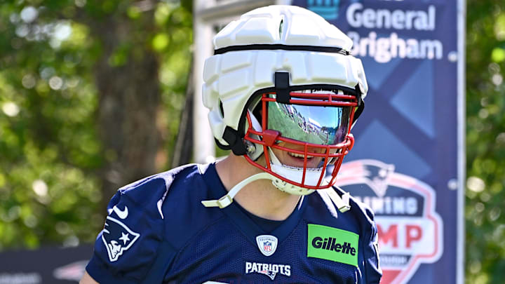 Jul 23, 2025; Foxborough, MA, USA; New England Patriots linebacker Robert Spillane (14) walks to the practice fields for training camp at Gillette Stadium. Mandatory Credit: Eric Canha-Imagn Images
