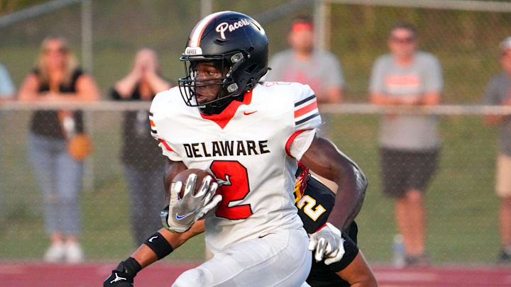 Sep 13, 2024; Sunbury, Ohio, USA; Delaware Hayes Favour Akih (2) runs the ball in for a touchdown against Big Walnut in the first half at Big Walnut High School.