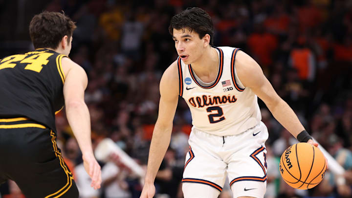 Mar 28, 2026; Houston, TX, USA; Illinois Fighting Illini guard Andrej Stojakovic (2) controls the ball against Iowa Hawkeyes guard Tate Sage (24) in the first half during an Elite Eight game of the South Regional of the men's 2026 NCAA Tournament at Toyota Center. Mandatory Credit: Troy Taormina-Imagn Images