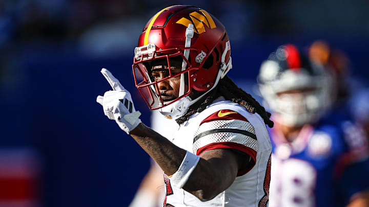 Nov 3, 2024; East Rutherford, New Jersey, USA; Washington Commanders wide receiver Noah Brown (85) reacts after a first down reception during the first half against the New York Giants at MetLife Stadium. Mandatory Credit: Vincent Carchietta-Imagn Images