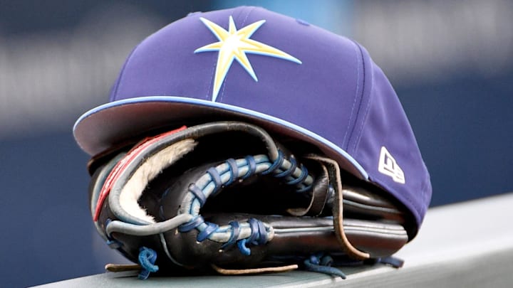 May 14, 2018; Kansas City, MO, USA; A general view of a Tampa Bay Rays hat and glove on the dugout fence before the game against the Kansas City Royals at Kauffman Stadium.