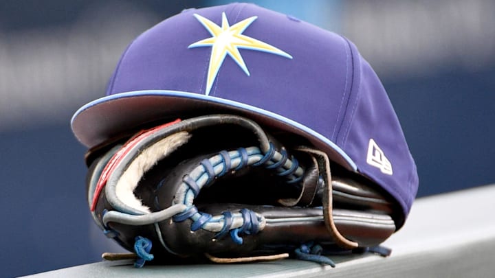 May 14, 2018; Kansas City, MO, USA; A general view of a Tampa Bay Rays hat and glove on the dugout fence before the game against the Kansas City Royals at Kauffman Stadium.