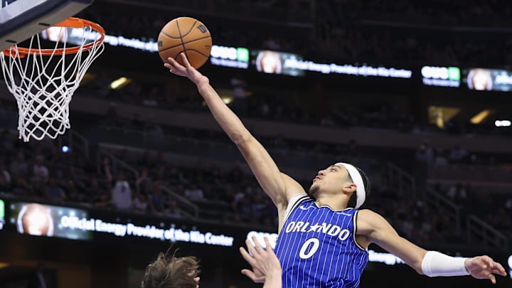Nov 22, 2025; Orlando, Florida, USA; Orlando Magic guard Anthony Black (0) drives to the basket past New York Knicks guard Tyler Kolek (13) in the fourth quarter at Kia Center. Mandatory Credit: Nathan Ray Seebeck-Imagn Images Nov 22, 2025; Orlando, Florida, USA; Orlando Magic guard Anthony Black (0) drives to the basket past New York Knicks guard Tyler Kolek (13) in the fourth quarter at Kia Center. Mandatory Credit: Nathan Ray Seebeck-Imagn Images