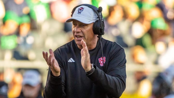 Oct 11, 2025; South Bend, Indiana, USA; NC State Wolfpack head coach Dave Doeren claps as he walks onto the field against the Notre Dame Fighting Irish during the second half at Notre Dame Stadium. Mandatory Credit: Michael Caterina-Imagn Images