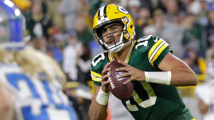 Green Bay Packers quarterback Jordan Love (10) moves out of the pocket before throwing a pass against the Lions in 2023.