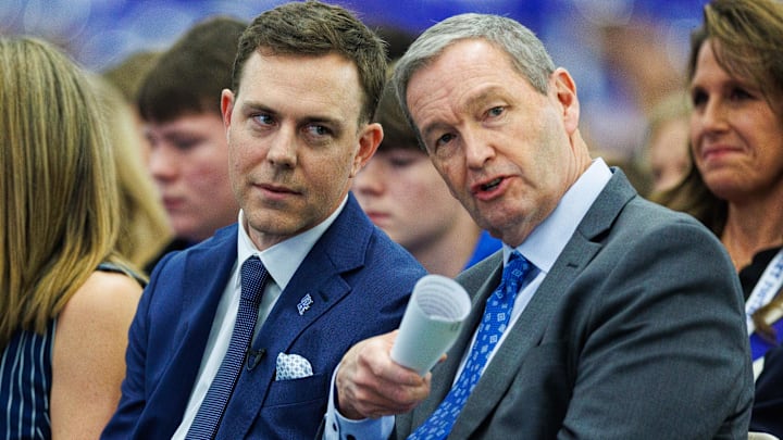 Dec 3, 2025; Lexington, KY, USA; Kentucky Wildcats athletic director Mitch Barnhart talks with head football coach Will Stein during his introductory press conference at Nutter Field House. Mandatory Credit: Jordan Prather-Imagn Images
