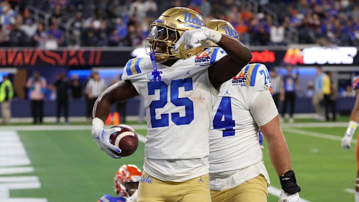 Dec 16, 2023; Inglewood, CA, USA; UCLA Bruins running back TJ Harden (25) reacts after scoring a touchdown against Boise State Broncos during the third quarter of the LA Bowl at SoFi Stadium. Mandatory Credit: Kiyoshi Mio-Imagn Images