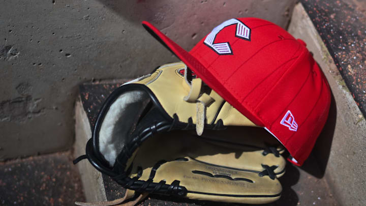 Apr 11, 2026; Cincinnati, Ohio, USA;  A view of an official Cincinnati Reds hat on the dugout steps during the game against the Los Angeles Angels at Great American Ball Park. Mandatory Credit: Aaron Doster-Imagn Images
