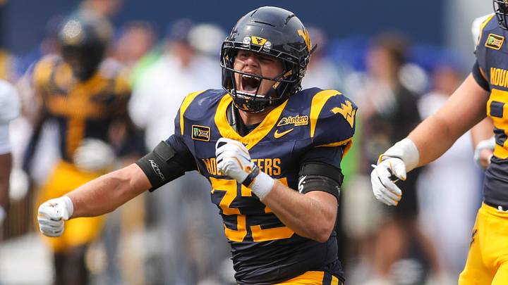Sep 12, 2026; Morgantown, West Virginia, USA;  West Virginia Mountaineers linebacker Ashton Woods (33) celebrates after a sack during the second quarter against the UT Martin Skyhawks at Milan Puskar Stadium.  Mandatory Credit: Ben Queen-Imagn Images