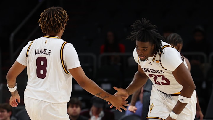 Dec 6, 2025; Phoenix, Arizona, USA; Arizona State University Sun Devils forward Allen Mukeba (23) high fives Arizona State University Sun Devils forward Marcus Adams Jr. (8) against Oklahoma University Sooners in the first half at PHX Arena. Mandatory Credit: Anna Carrington-Imagn Images Dec 6, 2025; Phoenix, Arizona, USA; Arizona State University Sun Devils forward Allen Mukeba (23) high fives Arizona State University Sun Devils forward Marcus Adams Jr. (8) against Oklahoma University Sooners in the first half at PHX Arena. Mandatory Credit: Anna Carrington-Imagn Images