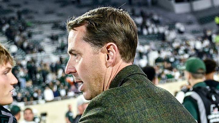 Michigan State's Athletic Director J Batt, right, congratulates players after the Spartans win over Western Michigan on Friday, Aug. 29, 2025, in East Lansing. Michigan State's Athletic Director J Batt, right, congratulates players after the Spartans win over Western Michigan on Friday, Aug. 29, 2025, in East Lansing.