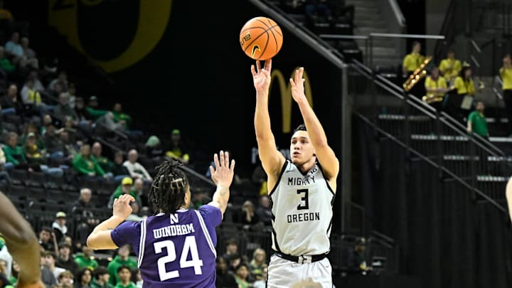 Feb 11, 2025; Eugene, Oregon, USA; Oregon Ducks guard Jackson Shelstad (3) scores a three-point basket against the Northwestern Wildcats during the second half at Matthew Knight Arena. Mandatory Credit: Craig Strobeck-Imagn Images