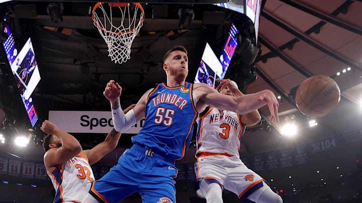 Jan 10, 2025; New York, New York, USA; Oklahoma City Thunder center Isaiah Hartenstein (55) fights for a rebound against New York Knicks center Karl-Anthony Towns (32) and guard Josh Hart (3) during the first quarter at Madison Square Garden. Mandatory Credit: Brad Penner-Imagn Images