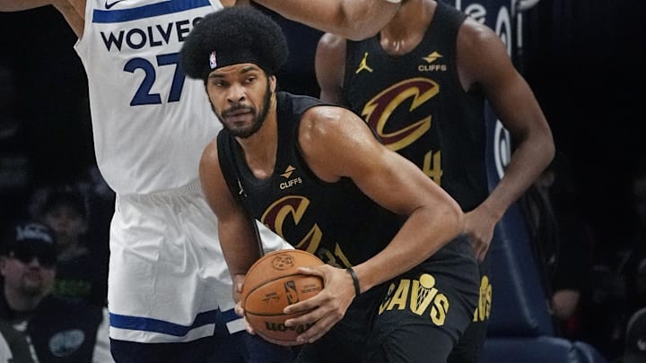 Jan 8, 2026; Minneapolis, Minnesota, USA; Cleveland Cavaliers center Jarrett Allen (31) looks to pass as Minnesota Timberwolves center Rudy Gobert (27) defends him in the first quarter  at Target Center. Mandatory Credit: Bruce Kluckhohn-Imagn Images
