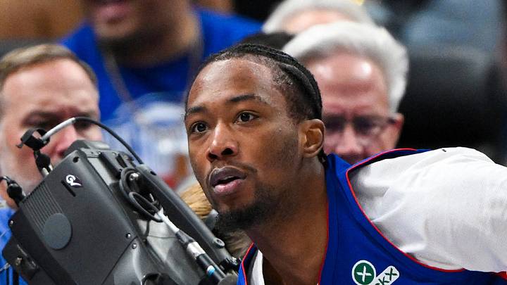 Oct 28, 2026; Detroit, Michigan, USA;  Detroit Pistons forward Ronald Holland II (5) looks at the refs after being called for a foul after colliding with Charlotte Hornets guard Sion James (on the ground) in the second half at Little Caesars Arena.  Mandatory Credit: Lon Horwedel-Imagn Images