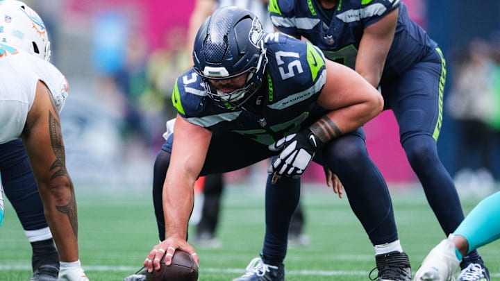 Sep 22, 2024; Seattle, Washington, USA; Seattle Seahawks center Connor Williams (57) prepares to snap the ball during the fourth quarter against the Miami Dolphins at Lumen Field. Mandatory Credit: Kevin Ng-Imagn Images