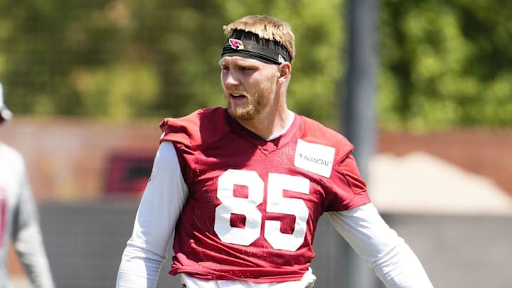 Arizona Cardinals tight end Trey McBride (85) talks to quarterback Jacoby Brissett (7) during organized team practice at the Arizona Cardinals training center in Tempe on June 3, 2025. Arizona Cardinals tight end Trey McBride (85) talks to quarterback Jacoby Brissett (7) during organized team practice at the Arizona Cardinals training center in Tempe on June 3, 2025.