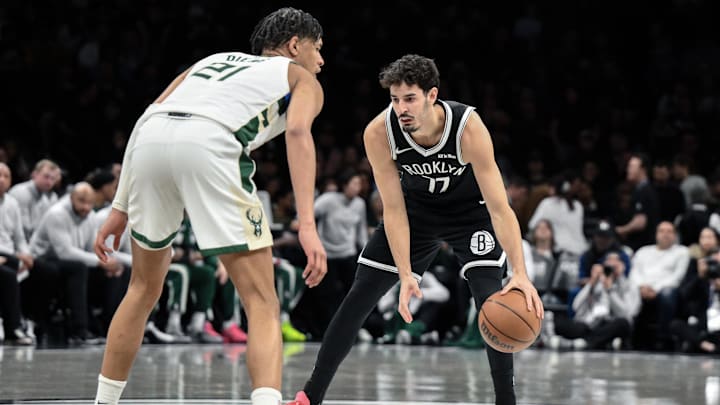Apr 7, 2026; Brooklyn, New York, USA; Brooklyn Nets guard Ben Saraf (77) sets a play while defended by Milwaukee Bucks forward Ousmane Dieng (21) during the first half at Barclays Center. Mandatory Credit: John Jones-Imagn Images Apr 7, 2026; Brooklyn, New York, USA; Brooklyn Nets guard Ben Saraf (77) sets a play while defended by Milwaukee Bucks forward Ousmane Dieng (21) during the first half at Barclays Center. Mandatory Credit: John Jones-Imagn Images