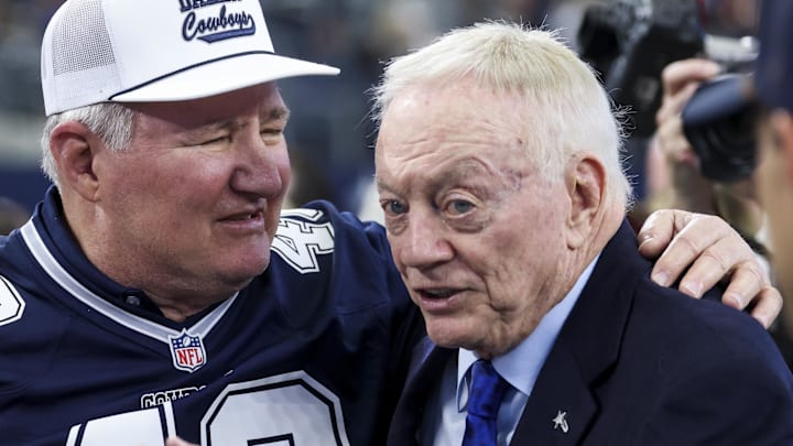 Dallas Cowboys owner Jerry Jones (right) speaks with former player Bill Bates (left) before the game against the Washington Commanders at AT&T Stadium.
