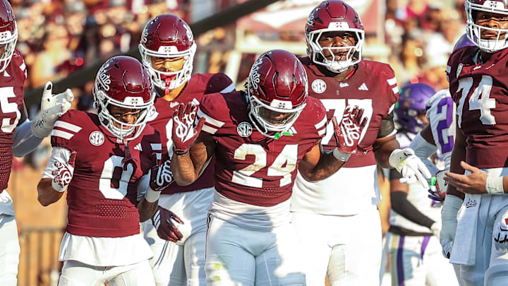 Mississippi State Bulldogs running back Fluff Bothwell (24) celebrates with teammates after a touchdown during the first quarter against the Alcorn State Braves at Davis Wade Stadium at Scott Field. 