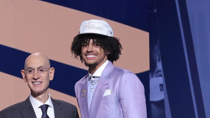 Jun 25, 2025; Brooklyn, NY, USA;  Asa Newell stands with NBA commissioner Adam Silver after being selected as the 23rd pick by the New Orleans Pelicans in the first round of the 2025 NBA Draft at Barclays Center. Mandatory Credit: Brad Penner-Imagn Images