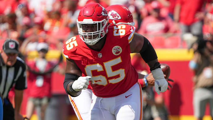 Aug 17, 2024; Kansas City, Missouri, USA; Kansas City Chiefs guard Trey Smith (65) prepares to block against the Detroit Lions during the game at GEHA Field at Arrowhead Stadium. Mandatory Credit: Denny Medley-Imagn Images