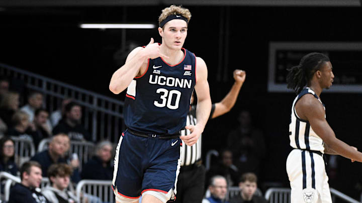 Dec 21, 2024; Indianapolis, Indiana, USA; Connecticut Huskies forward Liam McNeeley (30) celebrates after making a three point basket during the first half against the Butler Bulldogs at Hinkle Fieldhouse. Mandatory Credit: Robert Goddin-Imagn Images Dec 21, 2024; Indianapolis, Indiana, USA; Connecticut Huskies forward Liam McNeeley (30) celebrates after making a three point basket during the first half against the Butler Bulldogs at Hinkle Fieldhouse. Mandatory Credit: Robert Goddin-Imagn Images